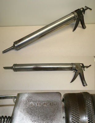 Photo of 2 silver Albion caulk guns