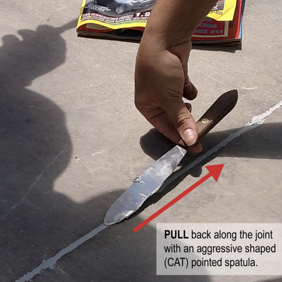 Instructional image on how to pull back a spatula to smooth out the sealant
